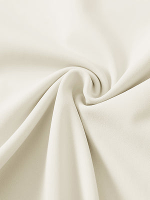 Close-up of ultra-stretch quick dry fabric used in cream women's golf sweatpants