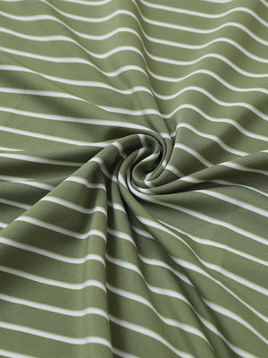 Close-up of light green/white popular yarn dyed stripe polo fabric showing crisp lines and soft texture.