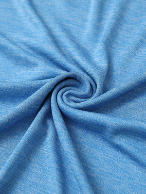 Close-up of blue heather modern fit melange polo fabric showing soft and textured surface.