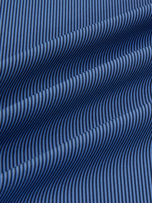 Close-up fabric view of long sleeve pinstripe jersey polo, smooth knit with subtle blue denim stripe stripes