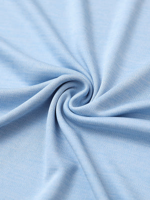 Close-up of light blue heather modern fit melange polo fabric showing soft and textured surface.