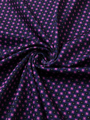 Close-up of black purple flower performance jersey print polo fabric texture.