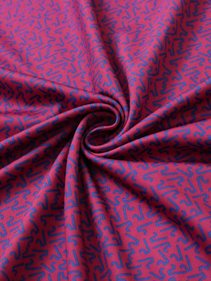 Close-up of rose abstract figure performance jersey print polo fabric showing breathable texture.
