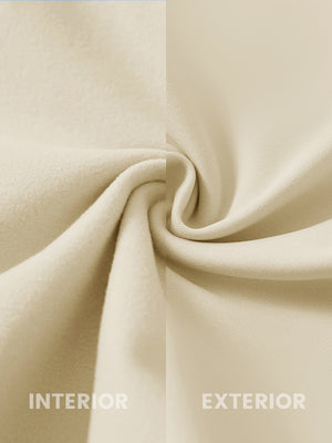 Close-up of the inner and outer fabric of women's stretch fleece lined water resistant joggers in light khaki, showing fleece lining and exterior.