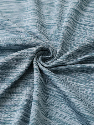 Close-up of slate green heather texture polo fabric showing soft surface.