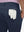 Detail view of back pocket on navy breathable casual slacks with 4 pockets
