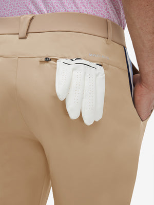 Detail view of back pocket on light khaki breathable casual slacks with 4 pockets