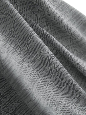 Close-up of light grey flower breathable jacquard pattern 3-button golf polo fabric texture