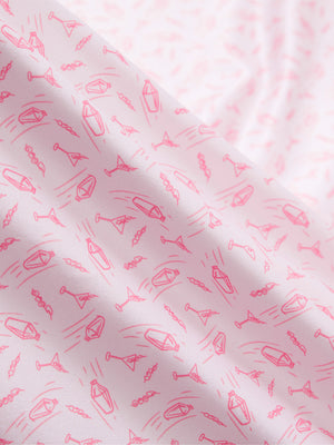 Macro view of the pink wine glass 4 way stretch print collared polo shirt fabric, showcasing the unique print design