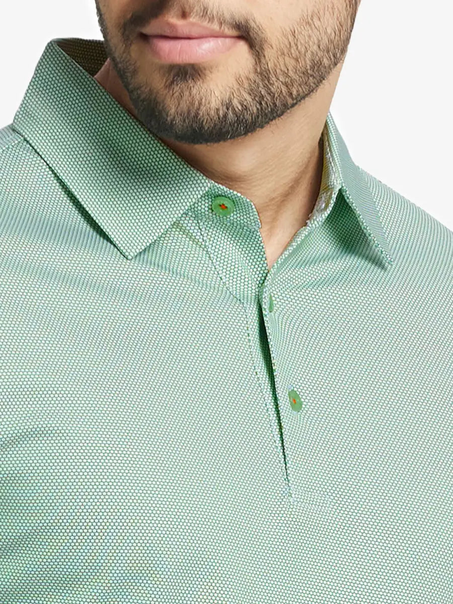 Close-up front view from nose to chest wearing EMERALD Performance Ananas Jacquard Polo