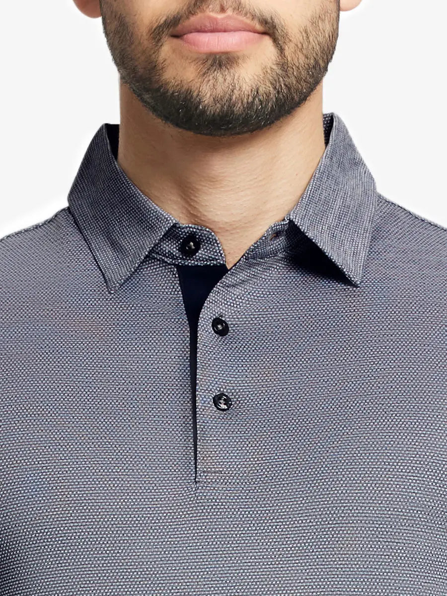 Model front close-up from nose to chest wearing Ventilated Heather Jacquard Polo in NAVY HEATHER