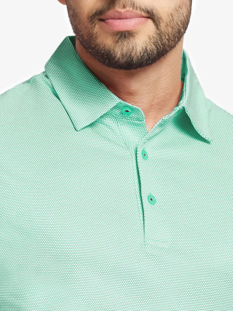 Close-up front view from nose to chest wearing ICE GREEN Performance Ananas Jacquard Polo