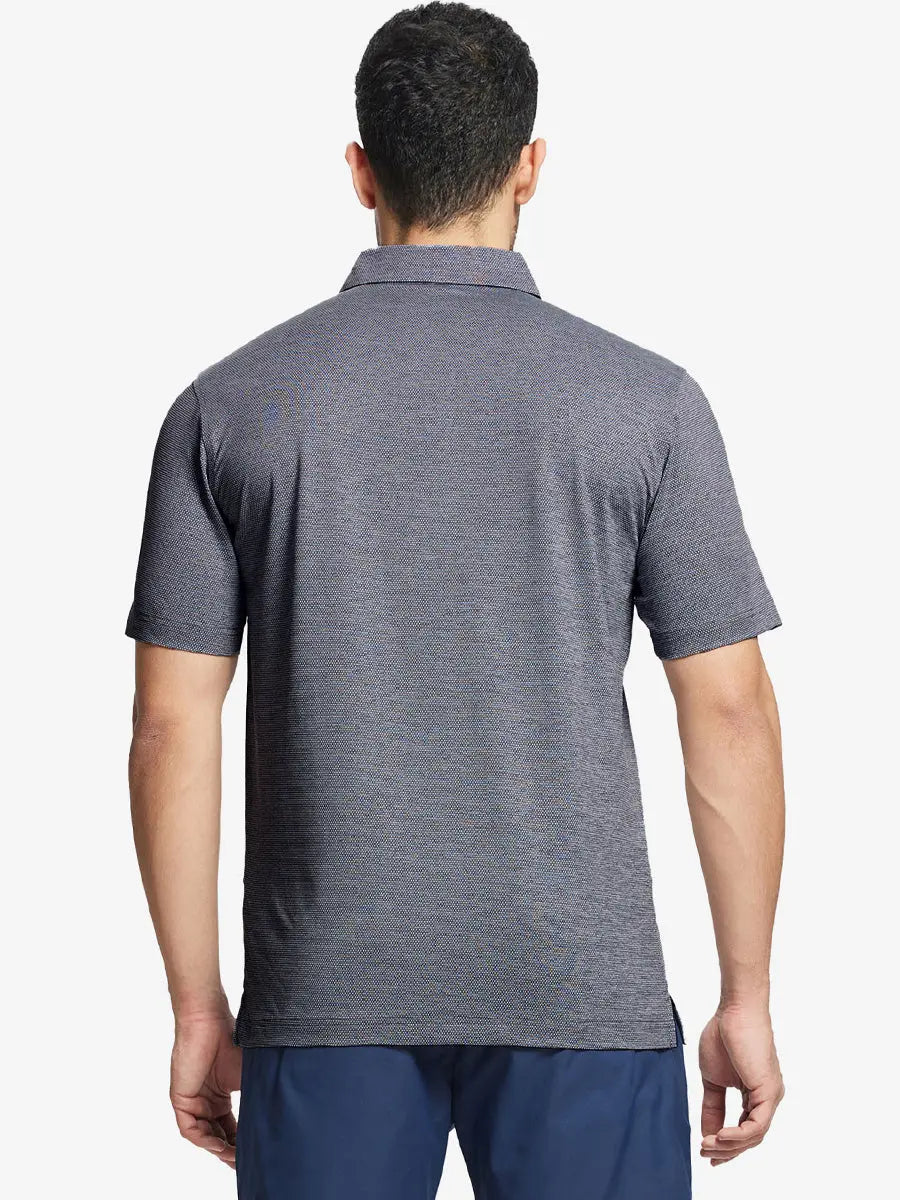 Front half-body shot of model holding golf club wearing Ventilated Heather Jacquard Polo – NAVY HEATHER