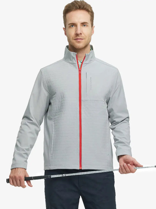 Front-facing half-body shot of model holding a golf club in the Light Grey Softshell Jacket – ready for the course