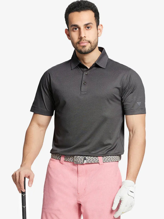 Model front half-body holding golf club wearing BLACK Performance Ananas Jacquard Polo