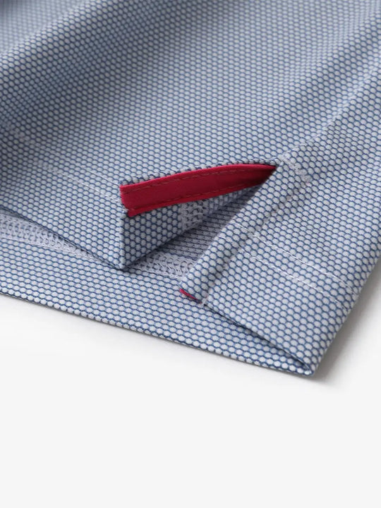 Close-up detail of side hem slit on LIGHT BLUE Performance Ananas Jacquard Polo