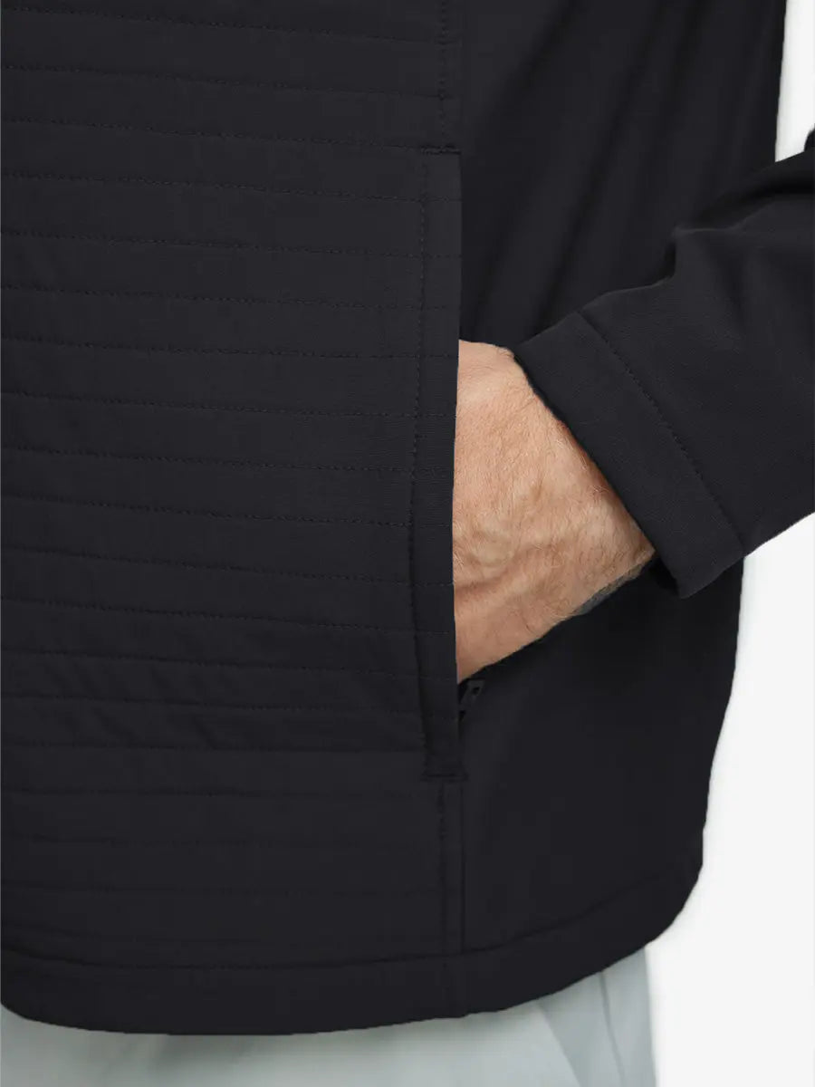 Detail shot of hand in right pocket, showing off the functional side pocket on the Black Softshell Jacket