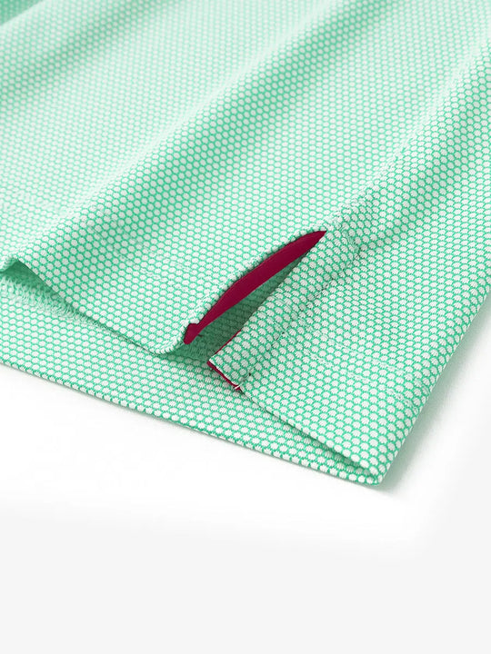 Close-up detail of side hem slit on ICE GREEN Performance Ananas Jacquard Polo