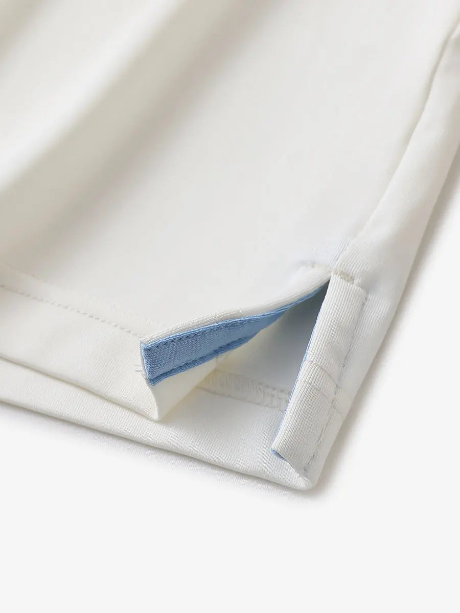 Side slit close-up of Chest Print Polo Shirts in Cream