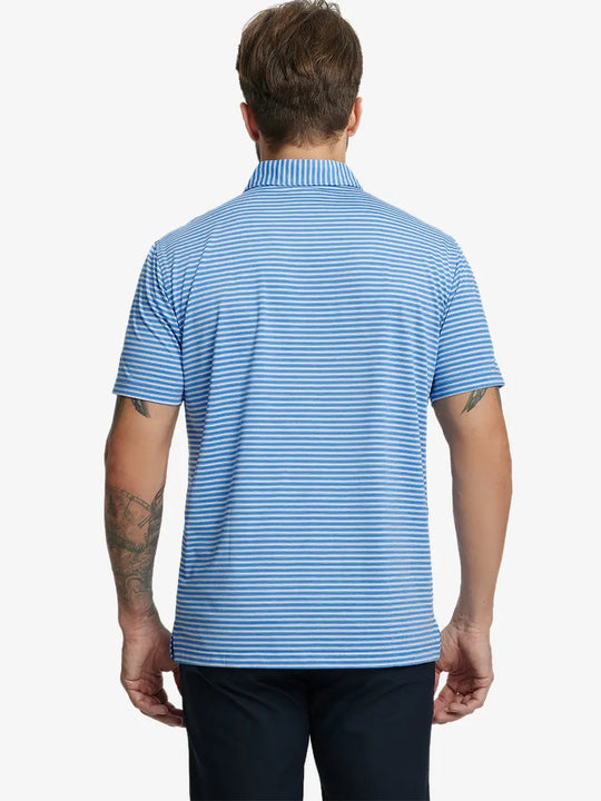 Back half-body shot of model showcasing the back of Sport Fit Stripe Polo in Classic Blue Stripe