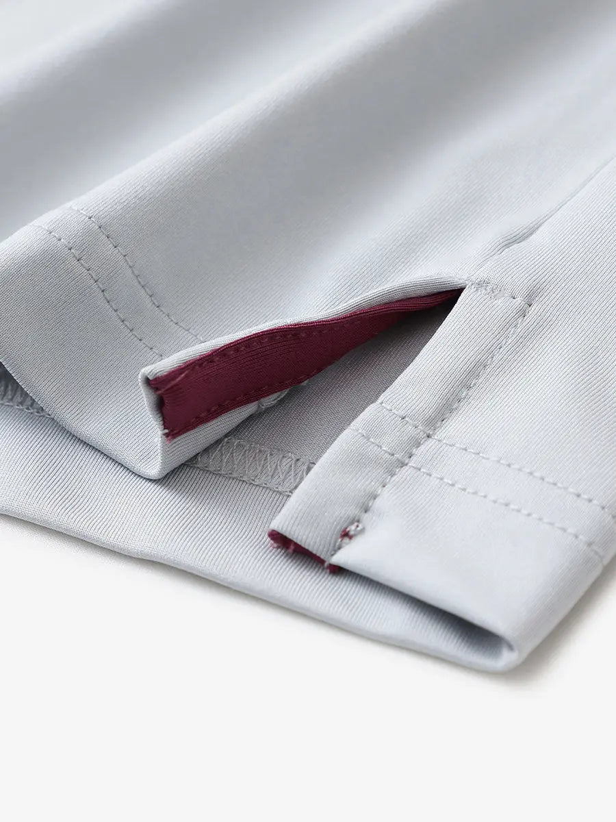 Close-up of hem slit detail in GLACIER GREY Premium Performance Polo