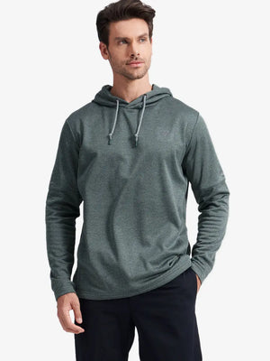 Half-body front shot of model styled in Green Heather hoodie with soft fleece fabric texture
