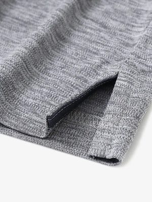 Close-up of hem opening on Modern Fit Melange Polo in GREY HEATHER, showcasing fine stitching and design.