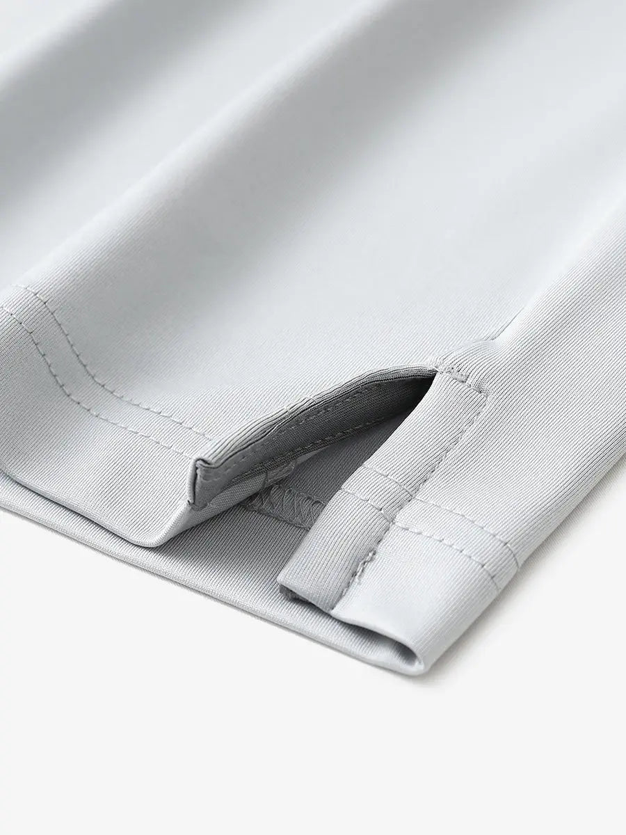 Close-up of hem slit detail in GREYGLACIER GREY Premium Performance Polo