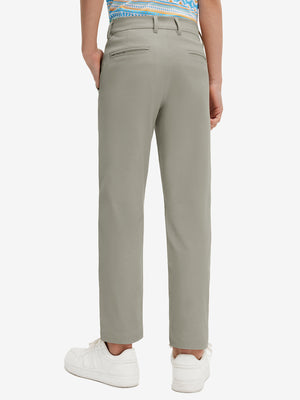 Back lower body view of model wearing the khaki grey youth water resistant cotton blend golf pants, highlighting the rear design