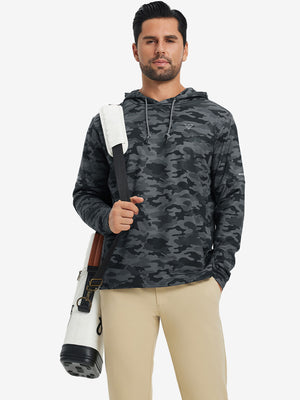 Model carrying a golf bag outdoors, styled in trendy print fleece hoodies with dark camouflage
