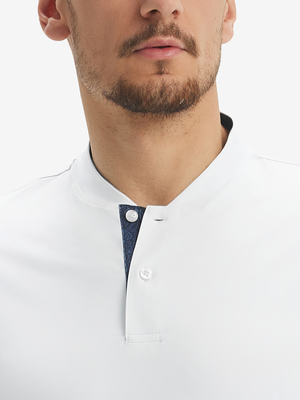 Close-up of model in white Henley, nose to chest view.