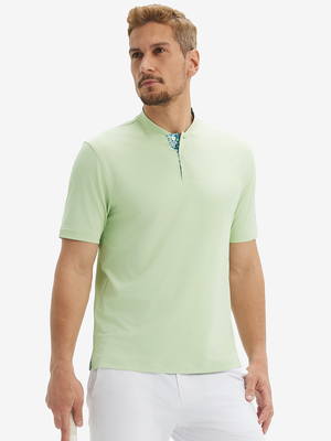 Front half-body view of model wearing light green moisture-wicking short sleeve henley shirt