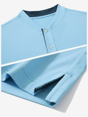 Detail of light blue moisture-wicking short sleeve henley shirt showing collar and hem vent construction.