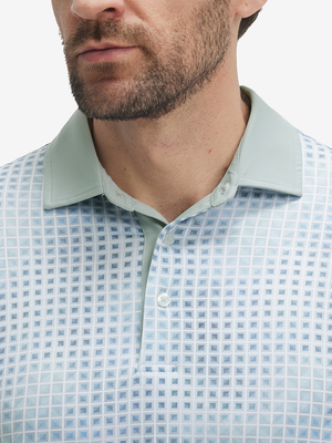 Close-up: nose to chest in bluish abstract lightweight stretch upgraded print golf polo shirts