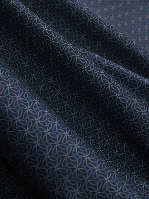 Close-up of dark blue windmill lightweight stretch upgraded print golf polo shirts, showcasing texture and print details.