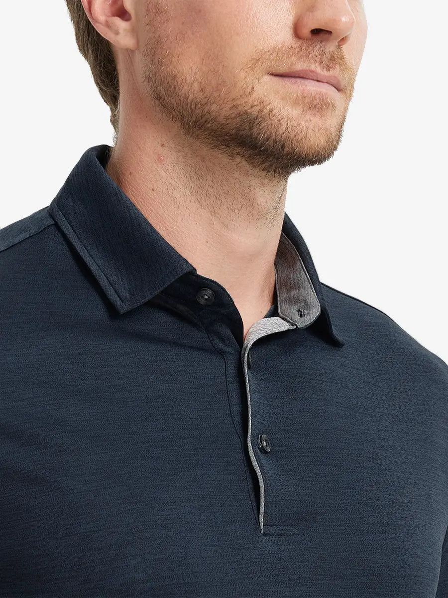 Close-up of Modern Fit Melange Polo front (nose to chest) in NAVY HEATHER, showing rich melange texture.