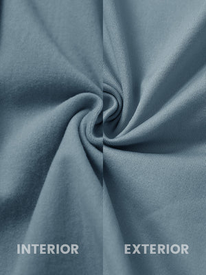 Inside and outer fabric close-up of slate blue lightweight water resistant puffer vest, quilted shell with soft lining.