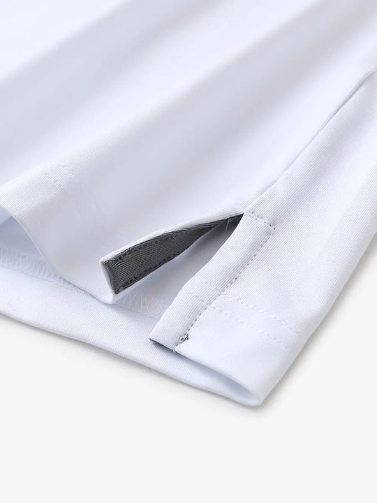 Close-up of hem slit detail in WHITE Premium Performance Polo